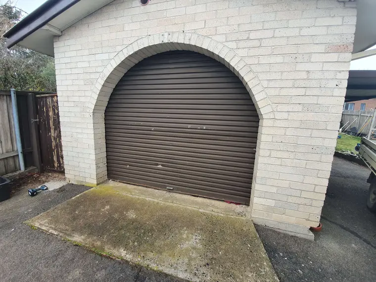 Arched garage door before repainting