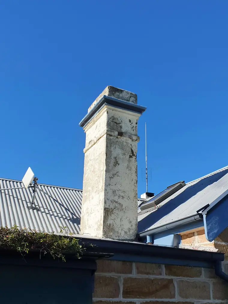 Rendered chimney before preparation and repainting