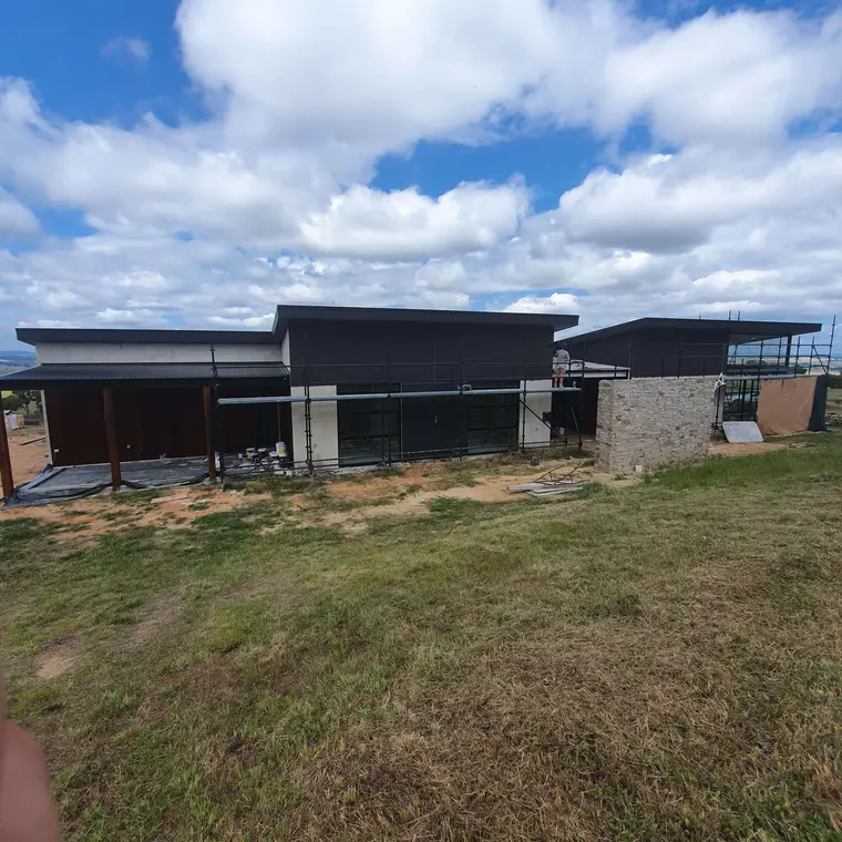 Contemporary country home exterior painting in progress