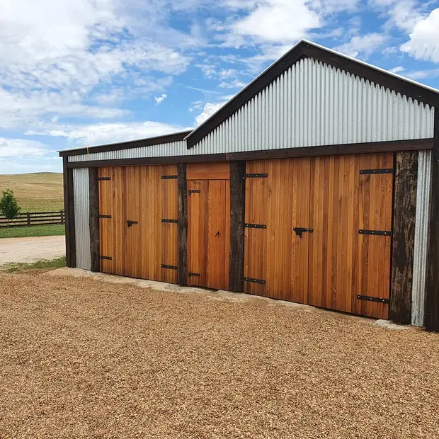 Alternate view of finished timber doors on a country shed
