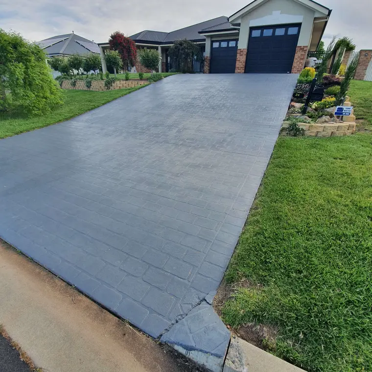 Concrete driveway after a fresh charcoal coating