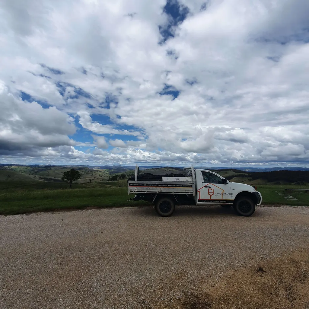Taylormade Painting And Decorating work vehicle overlooking countryside near Bathurst