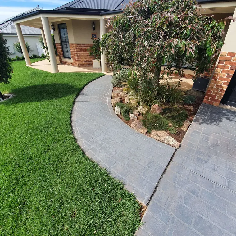 Faded concrete pathway before recoating