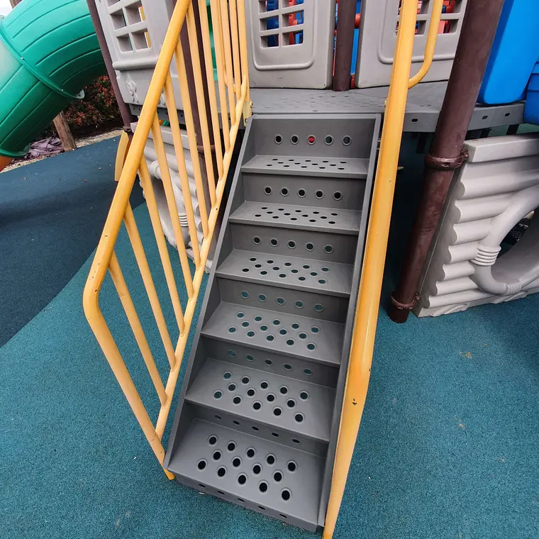 Playground stairs after preparation and grey repainting