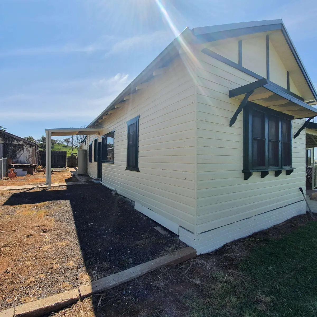 Weatherboard home after preparation and exterior repainting