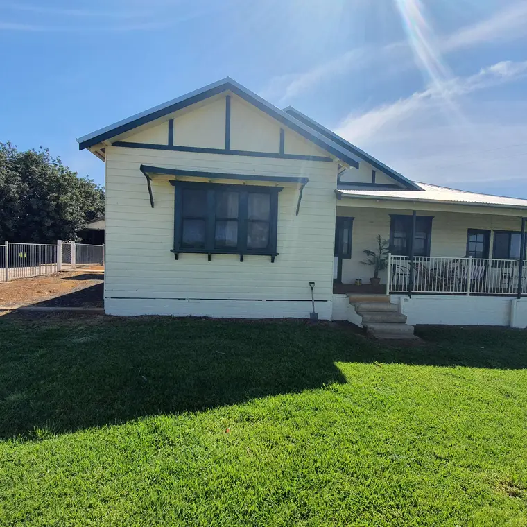 Country home frontage after weatherboard restoration and repainting